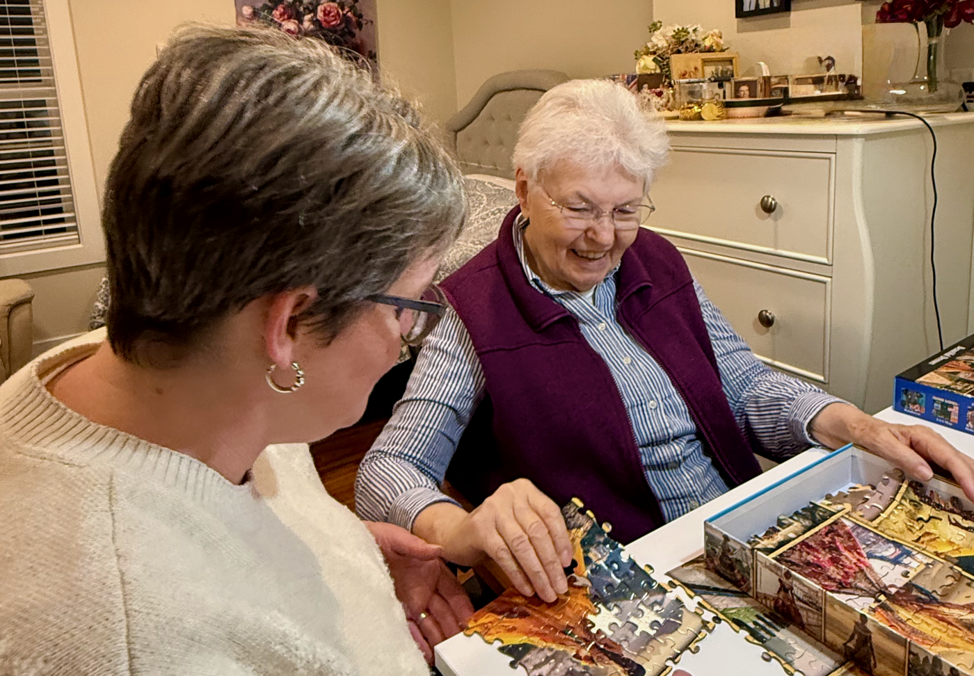 Melissa sharing a quiet, connected moment doing a puzzle together